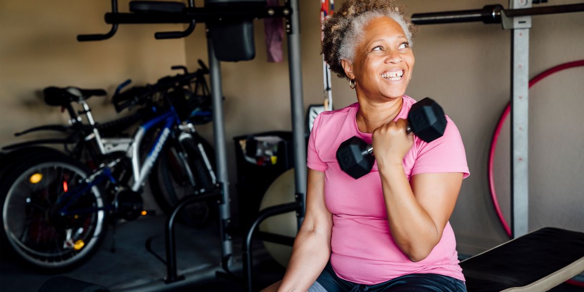 Image of woman in her own home weights gym