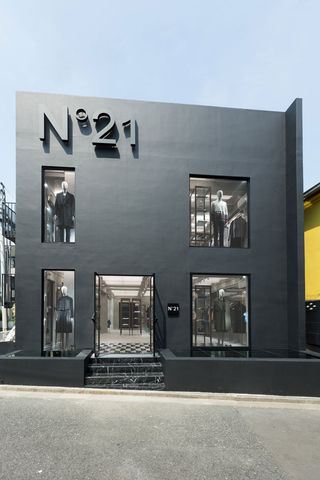 From the exterior, the store appears sharp, rigorous and masculine, rising from the street like a blackened-cement three-storey box