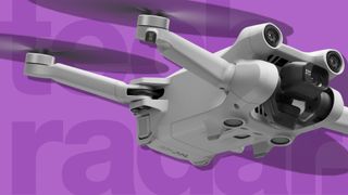 The DJI Mini 3 Pro, one of the best beginner drones, against a purple background