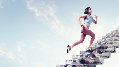 runner climbing money steps to the top of her retirement number