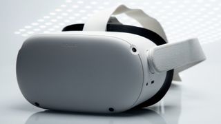 Das Virtual-Reality-Headset Oculus Quest 2 sitzt auf einem weißen Hintergrund mit funkelnden futuristischen Lichtern