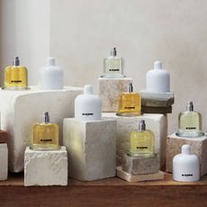 The new Jil Sander Olfactory Series 1 collection is grouped together on various marbled and textured stones