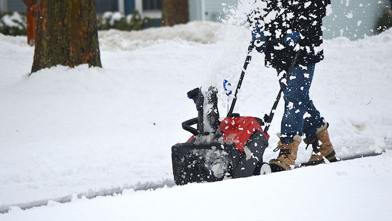 A snow blower on a drive