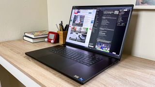 Razer Blade 18 open on a desk showing web browsers