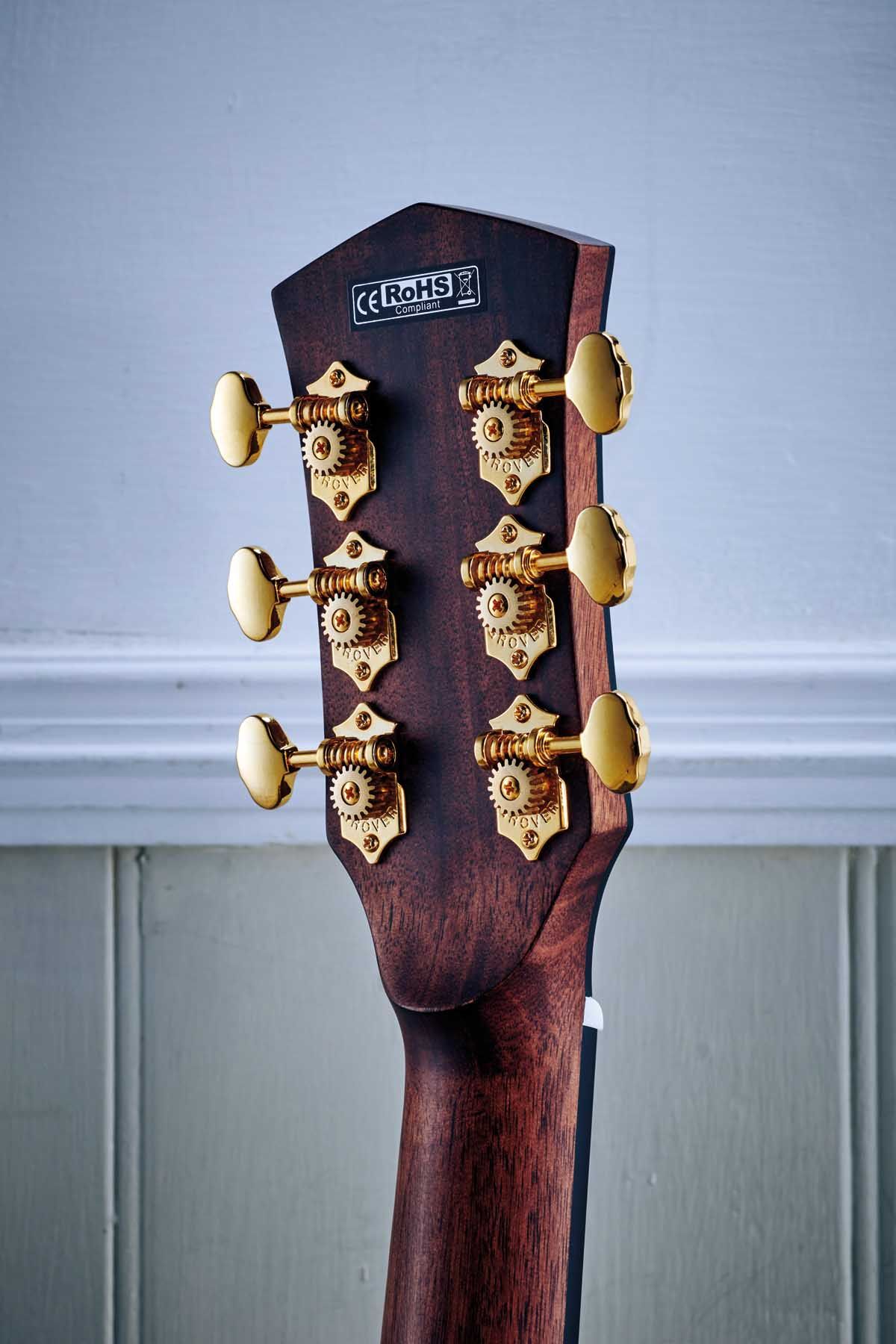 A set of Grover openback tuners offers the Cort a touch of elegance.