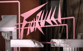 Pink sign 'Fiorucci' installed in crumbling pillars