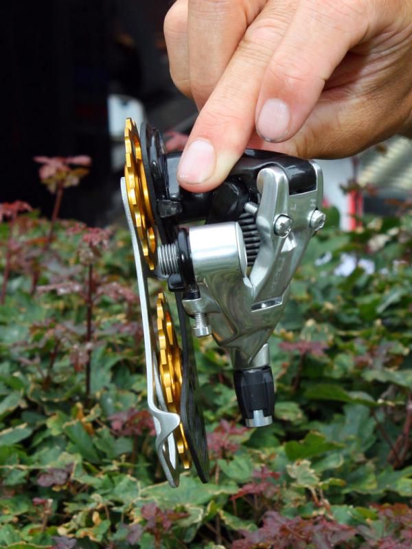 The Berner cage-equipped SRAM Red rear derailleurs use a carbon fiber outer cage plate and an aluminum inner one.