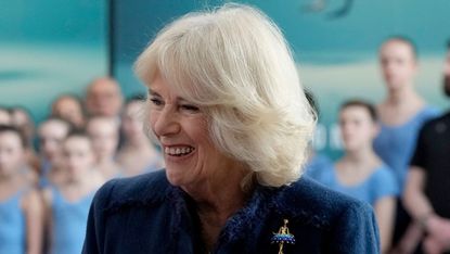 Queen Camilla’s unique ballerina brooch seen as she meets students during a visit to Elmhurst Ballet School