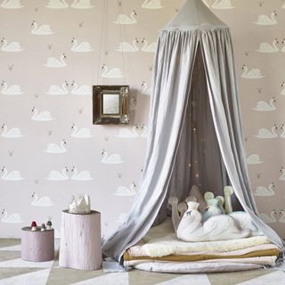 Pale pink swans wallpaper in child's room