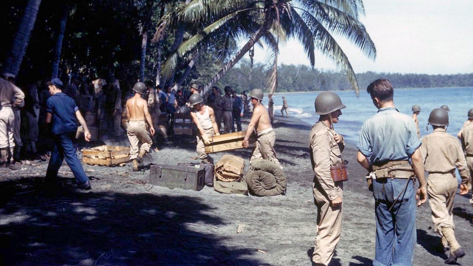 American troops unloading supplies on the shores of Guadalcanal Island. Dated 1943