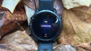 The Garmin Fenix 8 showing "Listening" for the new voice assistant