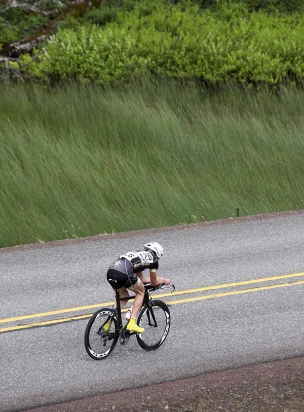 A rider fights the heavy wind in the time trial
