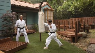 William Zabka as Johnny Lawrence, Tanner Buchanan as Robby Keene in Cobra Kai