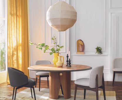 dining room with round table and big pendant light