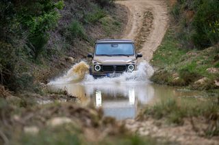 Mercedes-Benz G 580 with EQ Technology going through water, off road