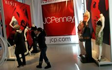 NEW YORK - MARCH 03:Customers walk through the new J.C. Penney 15,000-square foot temporary promotional store, or "pop-up" store, in Times Square March 3, 2006 in New York City. Part of the b