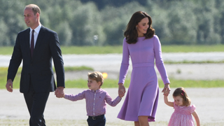 Britain's Prince William, Duke of Cambridge and his wife Kate, the Duchess of Cambridge, and their children Prince George and Princess Charlotte on the tarmac of the Airbus compound in Hamburg, northern Germany, on July 21,2017
