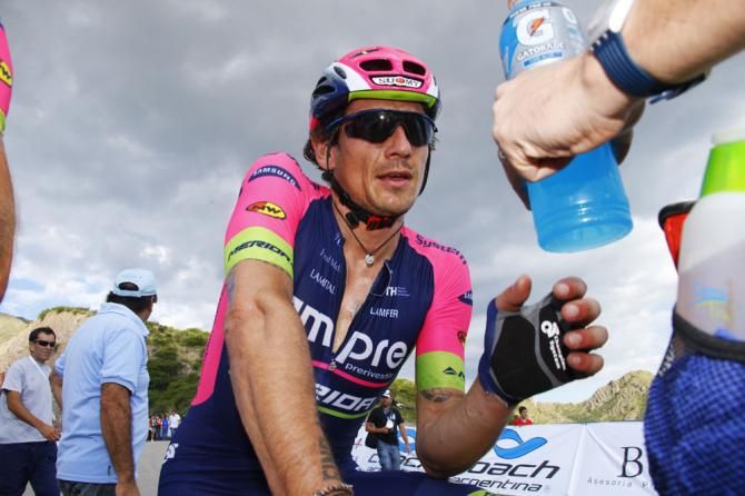 Flippo Pozzato gets a drink at the finish