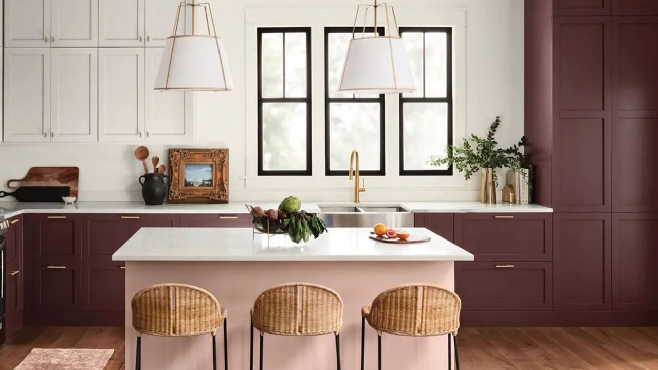 aubergine kitchen cabinets with light pink island