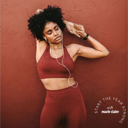 Tricep workouts: A woman stretching her arms after a workout