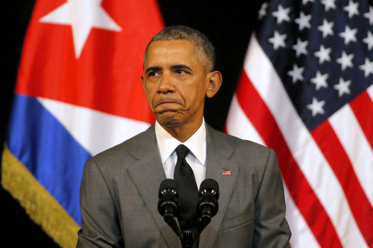 President Obama pauses as he delivers a speech on the recent terrorist attacks in Brussels, which occurred during his trip to Cuba.