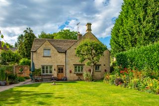 cotswold cottage exterior with the lawn