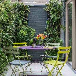 garden with bistro chairs and trees