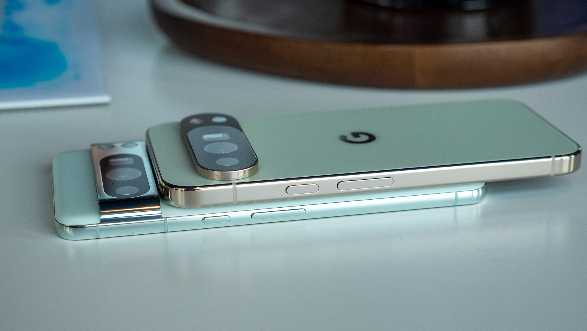 Comparing the mint Google Pixel 8 Pro's design to the jade Google Pixel 10 Pro XL's design