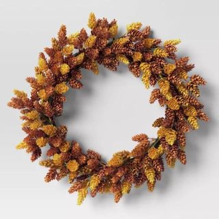 A fall wreath with orange and brown colors is one of the best Target fall decor items.