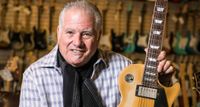 Norman Harris of Norman's Rare Guitars poses with a Les Paul at his legendary Tarzana, California guitar store.