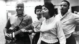 (from left) Pops (playing a Fender Jazzmaster), Cleotha, Pervis and Mavis record in the late 1960s.