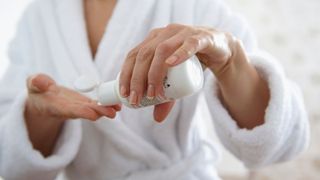 Woman using a non-abrasive exfoliator