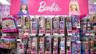 An assortment of Barbie dolls for sale