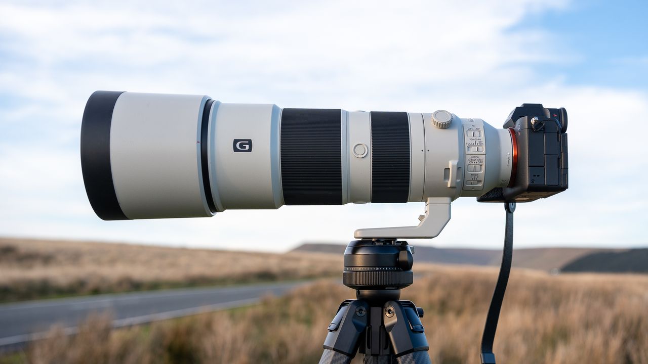 Sony FE 200-600 f/5.6-6.3 G OSS on a tripod in a field