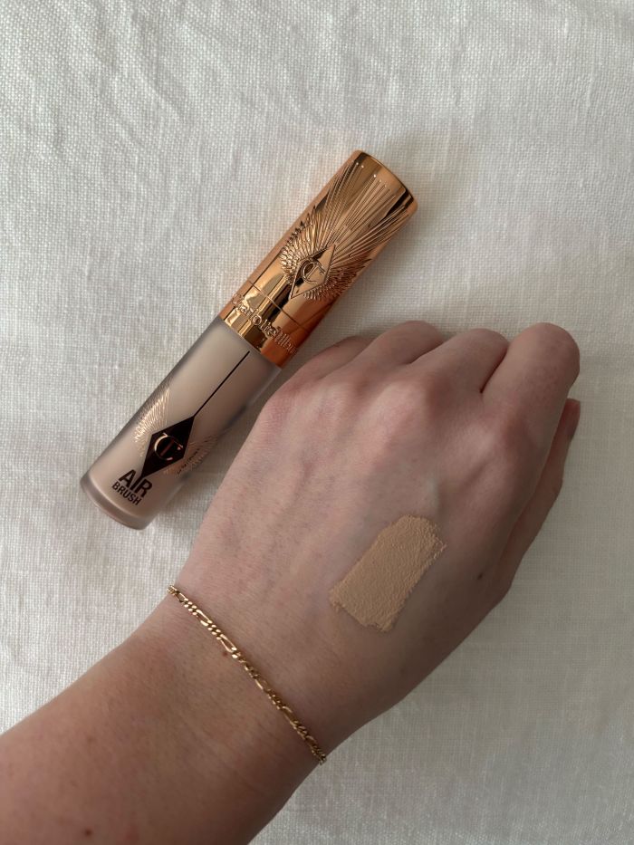 Deputy beauty editor Grace Lindsay testing a Charlotte Tilbury concealer on the back of her hand