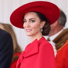 Catherine Princess of Wales wearing red cape dress