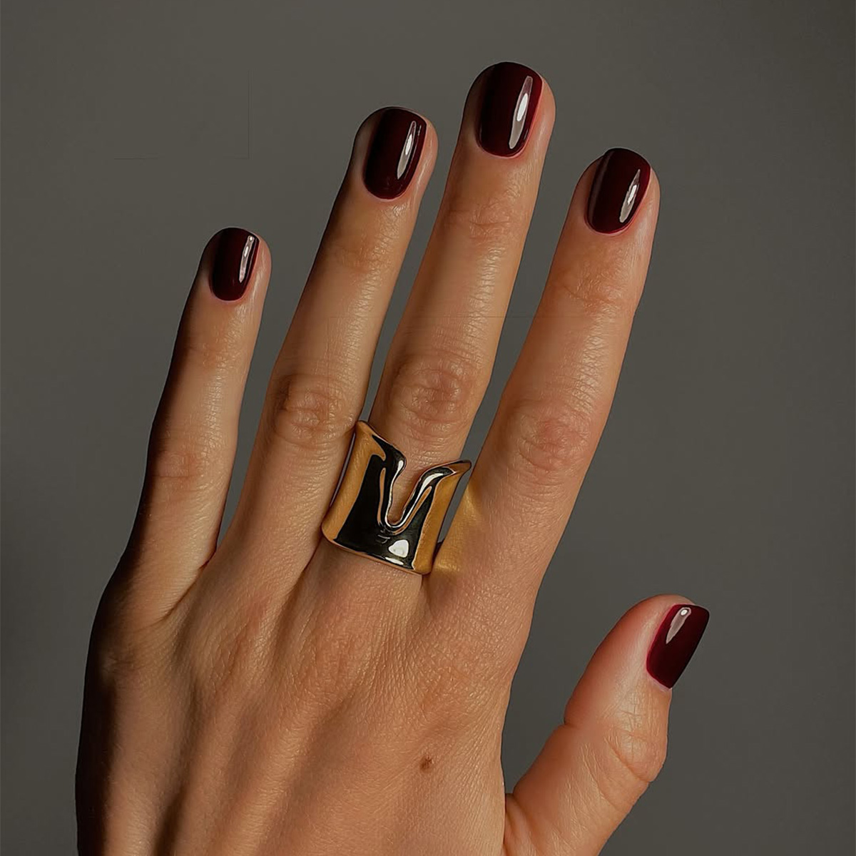 A deep red manicure by Mate Janova