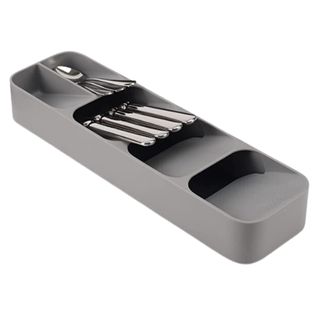 Grey drawer organizer with cutlery in it