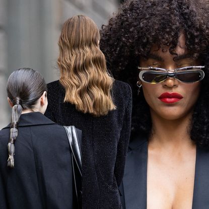 Three women at Milan Fashion Week sporting hair trends 2023