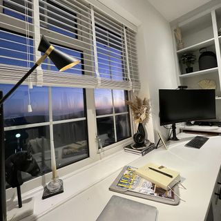 work desk white window with computer lamp and book