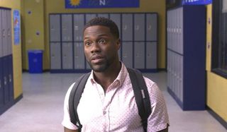 Night School Kevin Hart wearing a backpack, in the hall of a high school