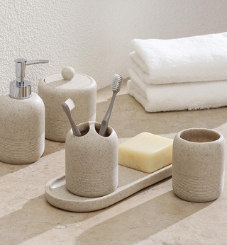 set of stoneware bathroom accessories