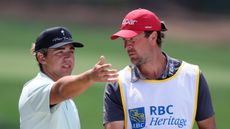 Garrick Higgo talks to his caddie Austin Gaugert during the RBC Heritage on the PGA Tour
