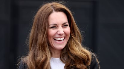 Catherine, Duchess of Cambridge smiles as she meets local fishermen and their families to hear about the work of fishing communities in the village of Pittennweem with Prince William, Duke of Cambridge on day six of their week long visit to Scotland on May 26, 2021 in Fife, Scotland