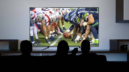 The Patriots vs the Seahawks on a TV.