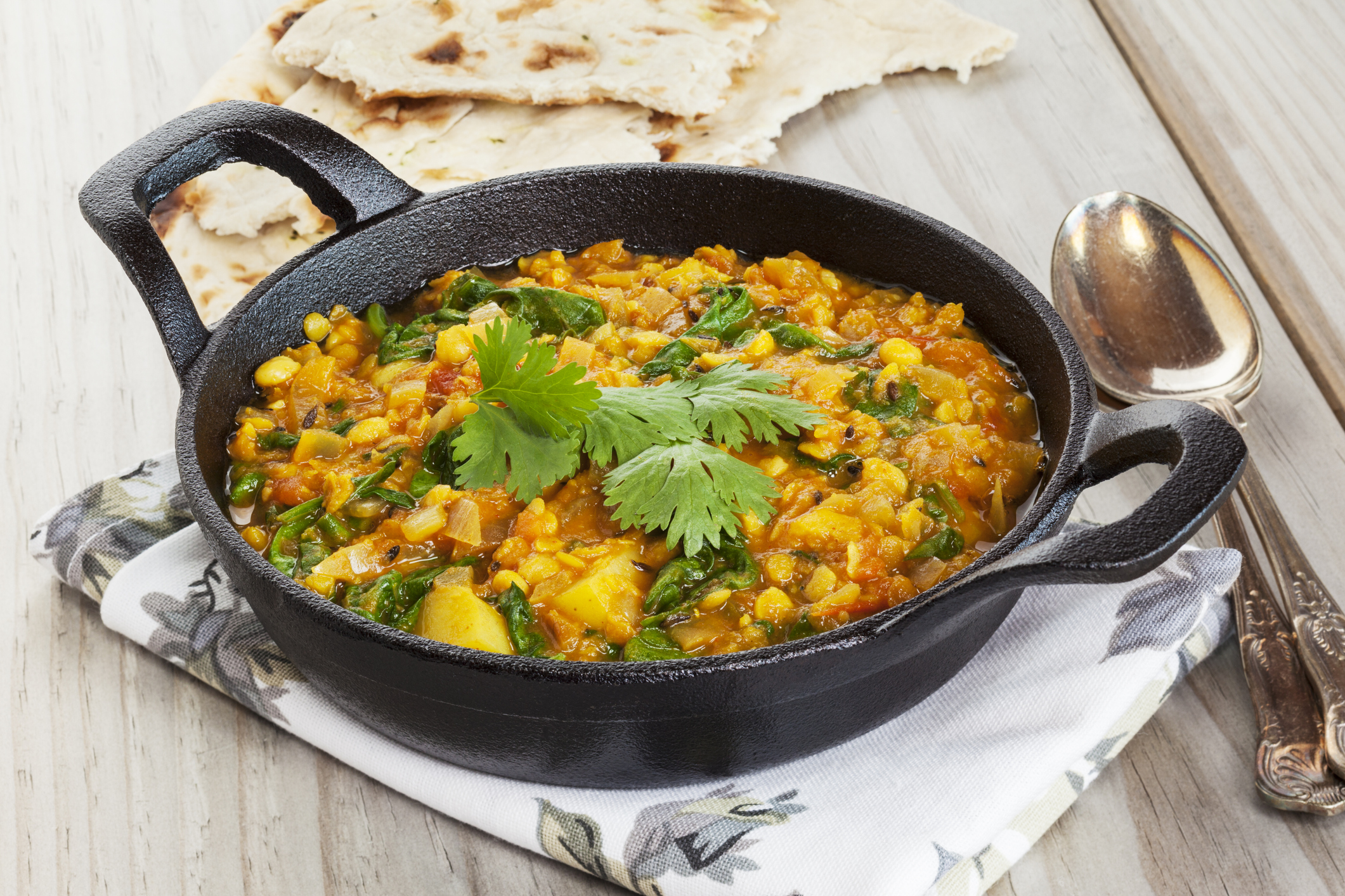Lentil and spinach curry in skillet