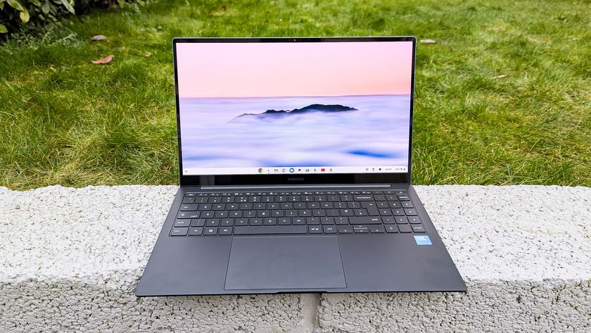 Samsung Galaxy Chromebook Plus placed on wall with grass background