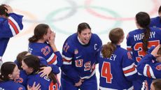 The U.S. women’s ice hockey team celebrates after winning the gold medal at the 2026 Winter Olympics.