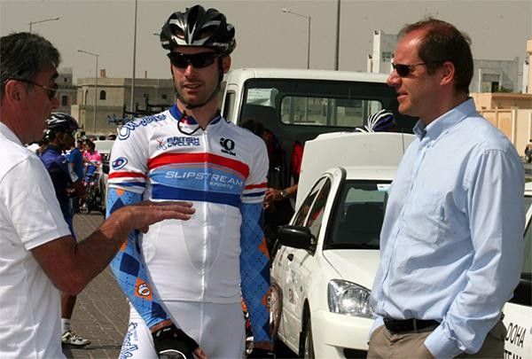 David Millar and Tour de France race director Christian Prudhomme speak with Eddy Merckx at the start of a stage of the 2008 Tour of Qatar.