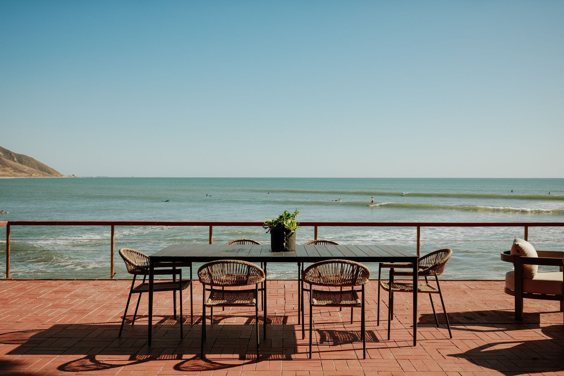 The living areas open onto a beachside terrace